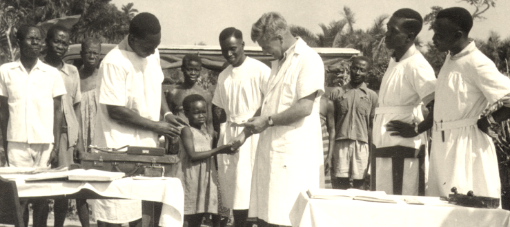 Old photo of an outdoor clinic in a village